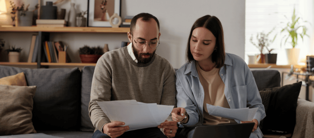 SEO and AI Visibility Case Study - Branch Based Financial Lender - image of couple with bills