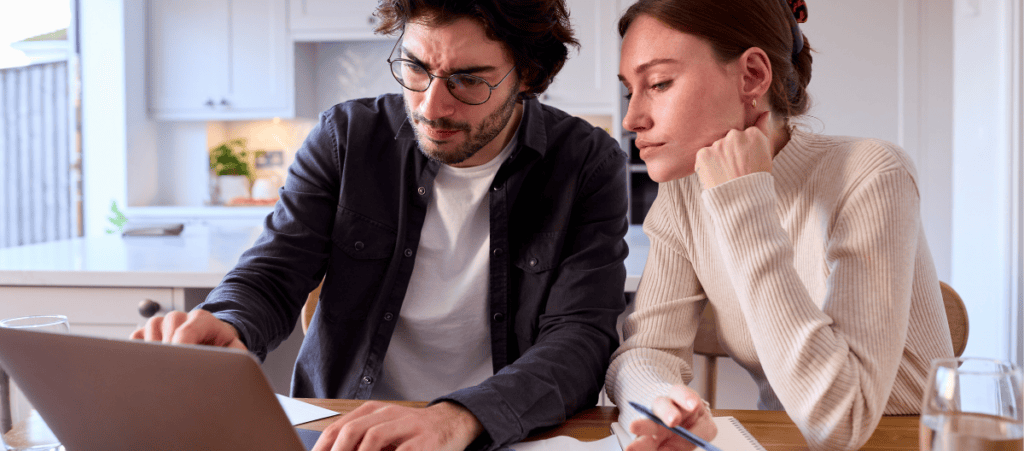 SEO and AI Visibility Case Study - Online Installment Lender - image of couple on computer pointing
