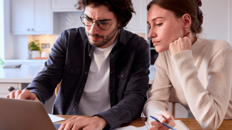 SEO and AI Visibility Case Study - Online Installment Lender - image of couple on computer pointing